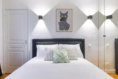 Un ou plusieurs lits dans un hébergement de l'établissement Élégant appartement 1 chambre pour 4 personnes au cœur de Paris, à Bastille