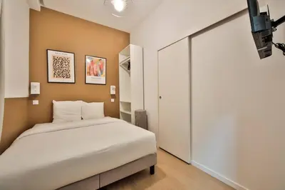 Un ou plusieurs lits dans un hébergement de l'établissement 0#Appart 4Pers#1 Bedroom#Paris 15#Commerce#AC