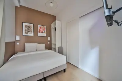 Un ou plusieurs lits dans un hébergement de l'établissement 0#Appart 4Pers#1 Bedroom#Paris 15#Commerce#AC