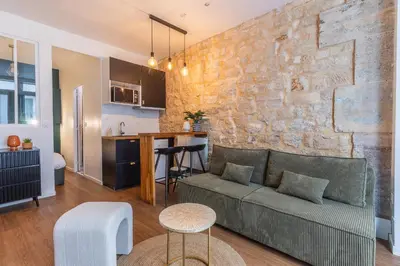Coin salon dans l'établissement Île SAINT LOUIS, NOTRE DAME, suite 1 chambre 2 à 4p