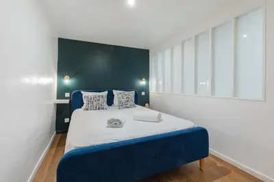 Un ou plusieurs lits dans un hébergement de l'établissement SENTIER, MARAIS, spacieux duplex 2 salles de bain
