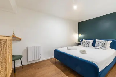 Un ou plusieurs lits dans un hébergement de l'établissement SENTIER, MARAIS, spacieux duplex 2 salles de bain