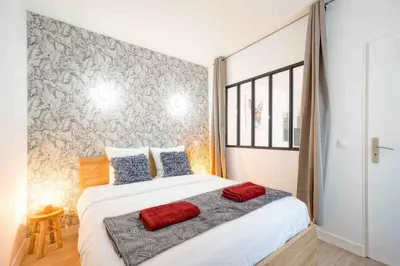 Un ou plusieurs lits dans un hébergement de l'établissement GRAND BOULEVARD, OPÉRA, suite 1 chambre 2 à 4P