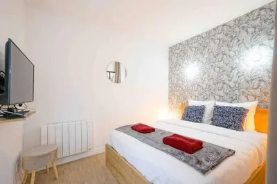 Un ou plusieurs lits dans un hébergement de l'établissement GRAND BOULEVARD, OPÉRA, suite 1 chambre 2 à 4P