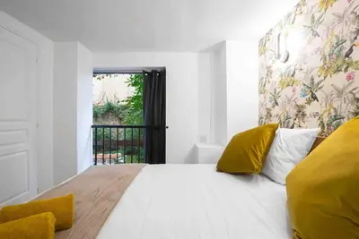 Un ou plusieurs lits dans un hébergement de l'établissement MONTMARTRE Sacré-Coeur, appartement jardin 6 à 8P