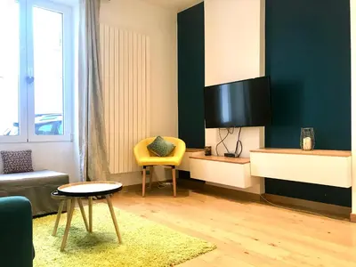 Coin salon dans l'établissement Adorable souplex batignolles