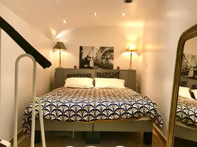 Un ou plusieurs lits dans un hébergement de l'établissement Adorable souplex batignolles