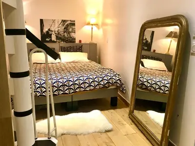 Un ou plusieurs lits dans un hébergement de l'établissement Adorable souplex batignolles