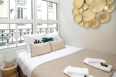 Un ou plusieurs lits dans un hébergement de l'établissement Nets Inn Apartment - Gare de Lyon