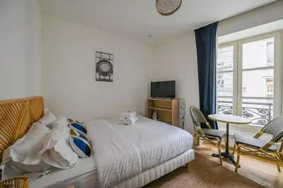 Un ou plusieurs lits dans un hébergement de l'établissement So cute Apartment (Opéra 3D)