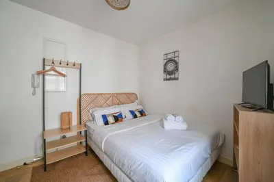 Un ou plusieurs lits dans un hébergement de l'établissement So cute Apartment (Opéra 3D)