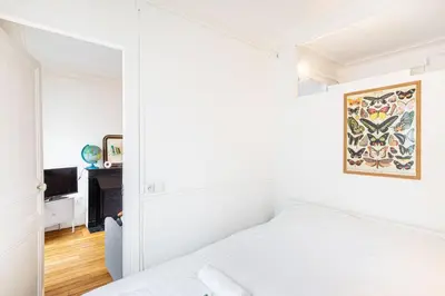 Un ou plusieurs lits dans un hébergement de l'établissement GuestReady - Charme et Confort dans le 11ᵉ arr.