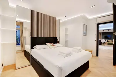 Un ou plusieurs lits dans un hébergement de l'établissement Elegant apartment - 2BR-6P - Le Marais