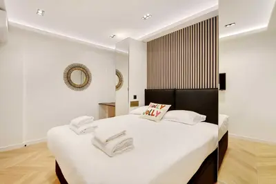 Un ou plusieurs lits dans un hébergement de l'établissement Elegant apartment - 2BR-6P - Le Marais