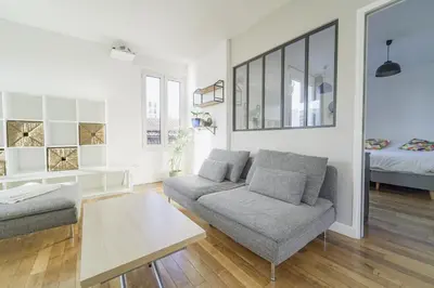 Un ou plusieurs lits dans un hébergement de l'établissement Quiet cosy and large apartment with Terrace Top location