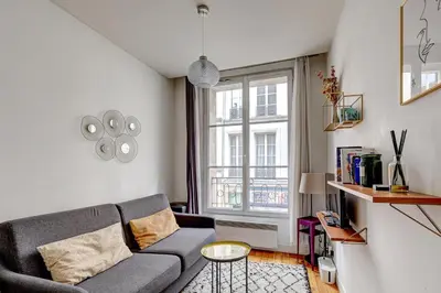 Coin salon dans l'établissement 310 Suite Petit Nid Douillet Apartment in Paris