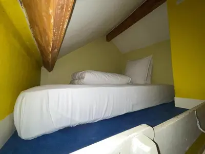 Un ou plusieurs lits dans un hébergement de l'établissement Montmartre Sacré Cœur - Appartement Martyrs