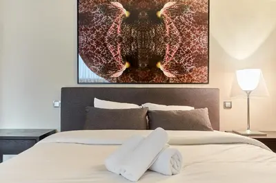 Un ou plusieurs lits dans un hébergement de l'établissement Apartment Arc de Triomphe by Studio prestige