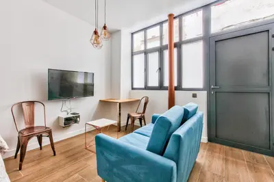 Télévision ou salle de divertissement dans l'établissement Suite Montorgueil