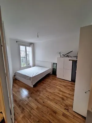 Un ou plusieurs lits dans un hébergement de l'établissement Cosy Appartement in Paris 15th - Convention Center