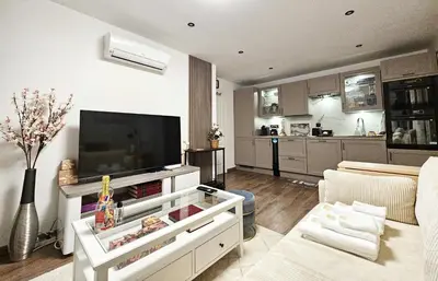Télévision ou salle de divertissement dans l'établissement Your cozy cove by Paris