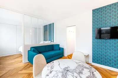 Télévision ou salle de divertissement dans l'établissement GuestReady - Appartement Grenelle