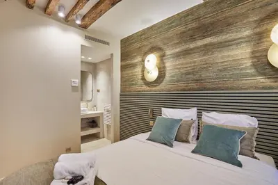Un ou plusieurs lits dans un hébergement de l'établissement Appartement au coeur de Paris Madeleine by Studio prestige
