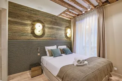 Un ou plusieurs lits dans un hébergement de l'établissement Appartement au coeur de Paris Madeleine by Studio prestige