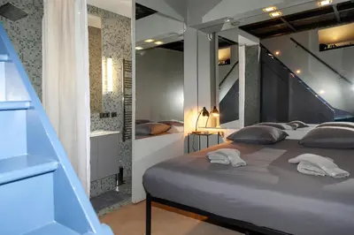 Un ou plusieurs lits dans un hébergement de l'établissement Loft atypique avec terrasse, calme et cosy