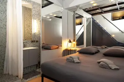 Un ou plusieurs lits dans un hébergement de l'établissement Loft atypique avec terrasse, calme et cosy