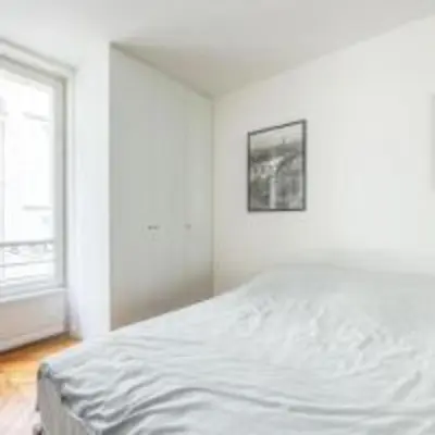 Un ou plusieurs lits dans un hébergement de l'établissement Parisian apartment for 6 pers Paris by askmefrance