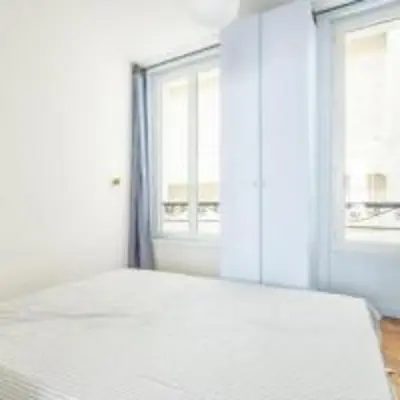 Un ou plusieurs lits dans un hébergement de l'établissement Parisian apartment for 6 pers Paris by askmefrance