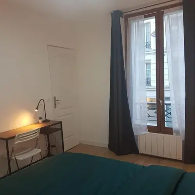 Un ou plusieurs lits dans un hébergement de l'établissement Studio cosy, quartier canal Saint-Martin