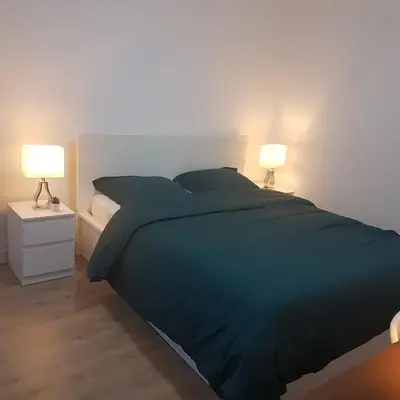Un ou plusieurs lits dans un hébergement de l'établissement Studio cosy, quartier canal Saint-Martin