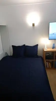 Un ou plusieurs lits dans un hébergement de l'établissement Aramis Colibri 72m2, lit king-size, baignoire duo hôte non professionnel