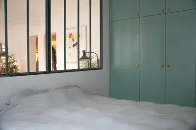 Un ou plusieurs lits dans un hébergement de l'établissement Family flat, 15' away from Paris city center