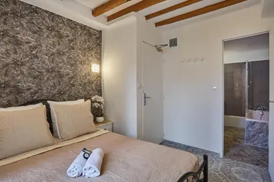 Un ou plusieurs lits dans un hébergement de l'établissement Hotel Petit Vix