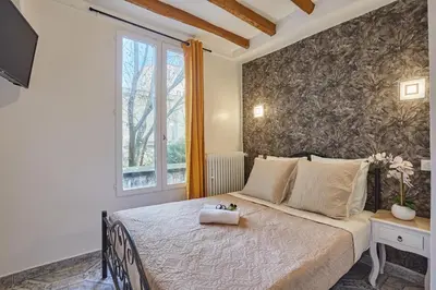 Un ou plusieurs lits dans un hébergement de l'établissement Hotel Petit Vix