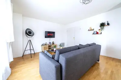 Coin salon dans l'établissement Cosy & Spacieux, Paris 10 min + Parking privé.