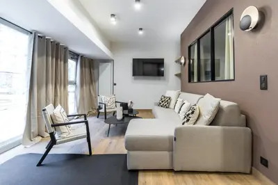 Coin salon dans l'établissement Appartement Design en Duplex 2BR à Oberkampf