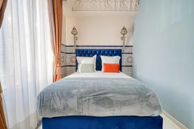 Un ou plusieurs lits dans un hébergement de l'établissement Marrakech Suite Champs Elysees