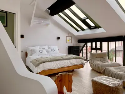 Un ou plusieurs lits dans un hébergement de l'établissement NEW : Atelier Artiste Montmartre