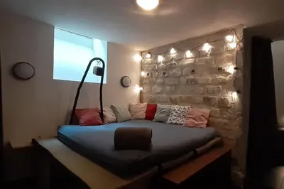 Un ou plusieurs lits dans un hébergement de l'établissement Appartement au coeur de Ménilmontant