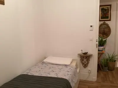 Un ou plusieurs lits dans un hébergement de l'établissement Chambre chez le habitant 282 rue Lecourbe 75015