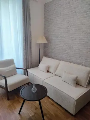 Coin salon dans l'établissement Stylish Parisian Flat near Eiffel Tower