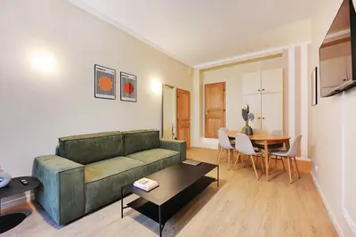 Coin salon dans l'établissement Charming Flat, quartier latin with a private cinema