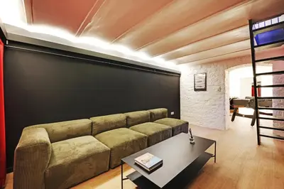 Coin salon dans l'établissement Charming Flat, quartier latin with a private cinema