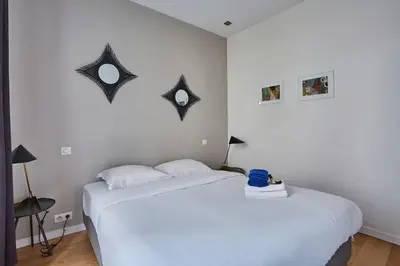 Un ou plusieurs lits dans un hébergement de l'établissement Rent a Room apartments - Alma