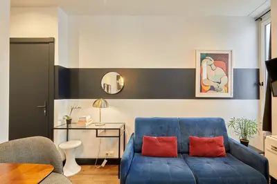 Coin salon dans l'établissement Rent a Room apartments - Alma
