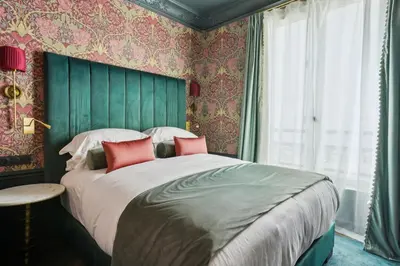 Un ou plusieurs lits dans un hébergement de l'établissement Séjours Parisiens - Suites Haussmann, Malesherbes & Madeleine